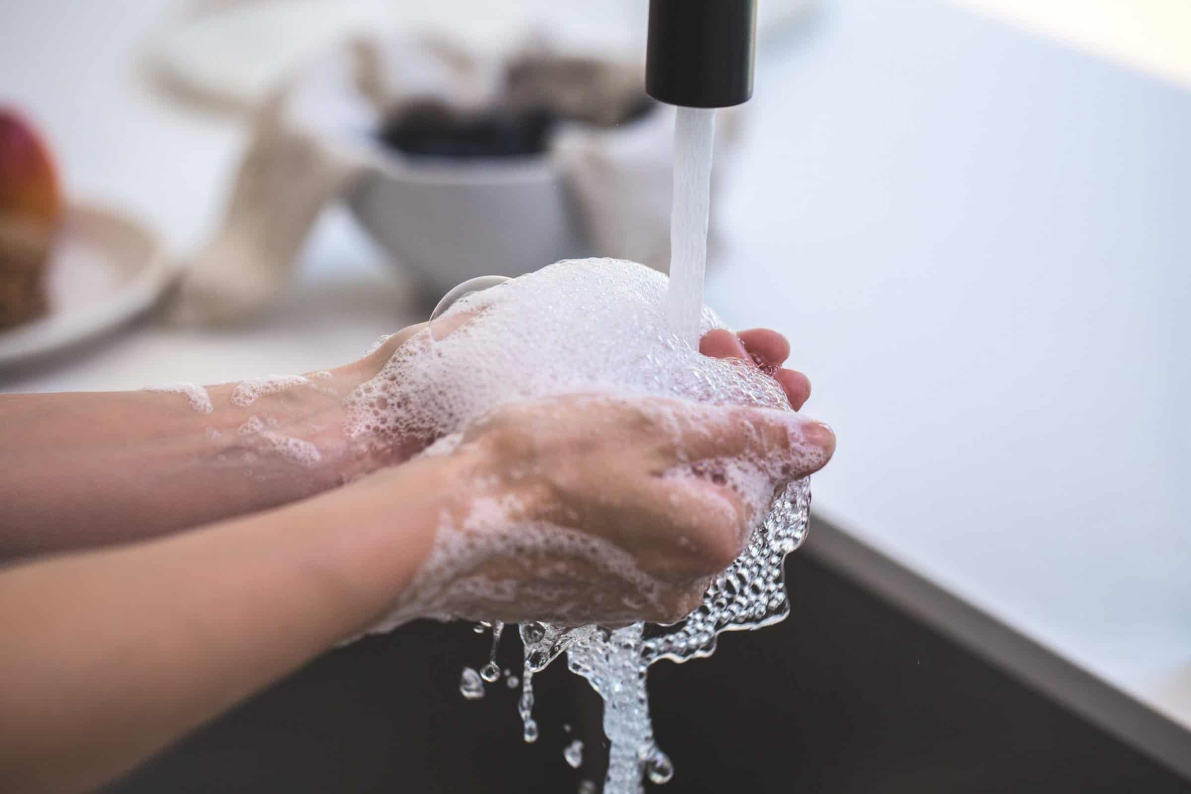 person-washing-his-hand-545014-scaled